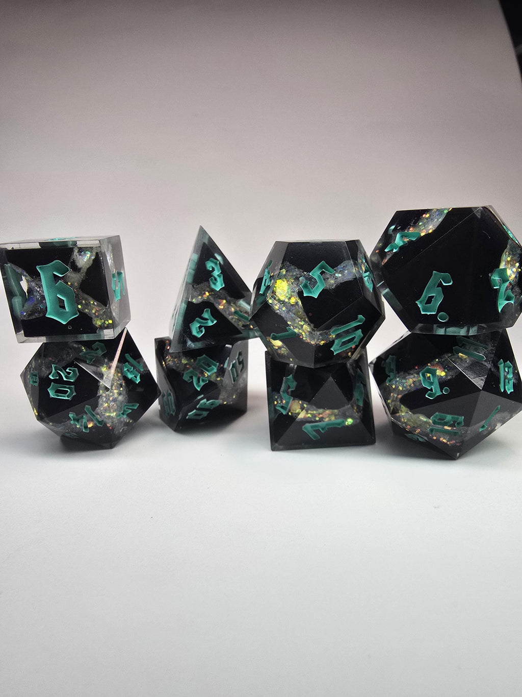 Handmade Black Resin Dice Set – Opal Glitter, Blue Glow Effect (8pc)